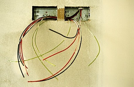 A040-00104_Electrical_wires_hanging_out_on_a_wall